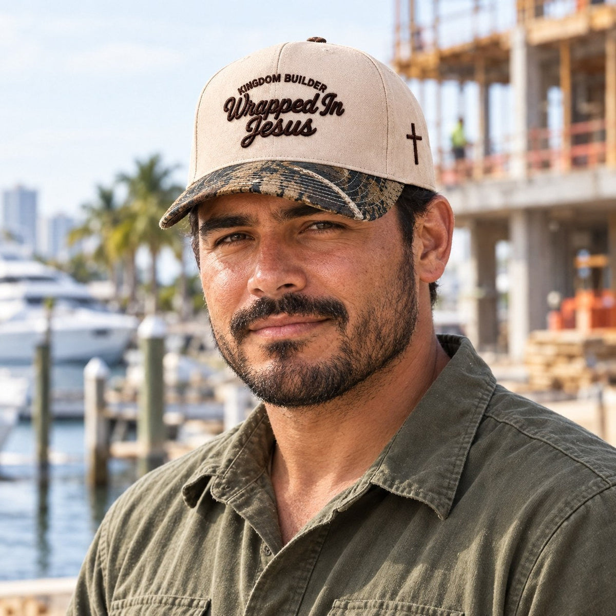 Man wearing tan Kingdom Builder Christian hat with camo brim at a South Florida marina
